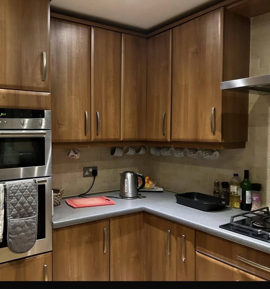 Kitchen before wrapping, wood-effect doors