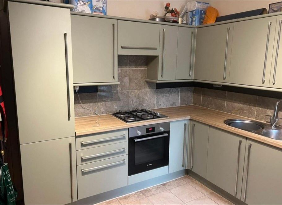 Same kitchen after wrapping in sage green